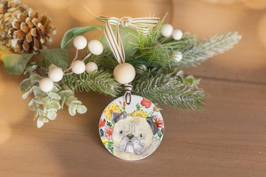 Ceramic Ornament with watercolor pug and colorful flowers on it.