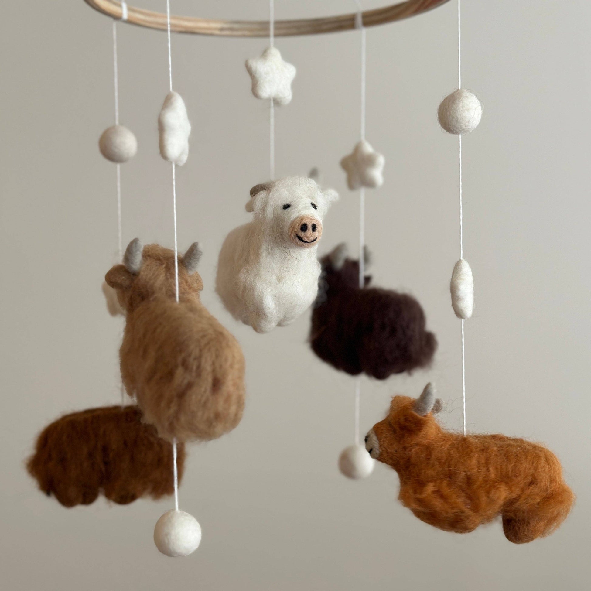 baby mobile with 5 needle felted wool highland cows in different colors