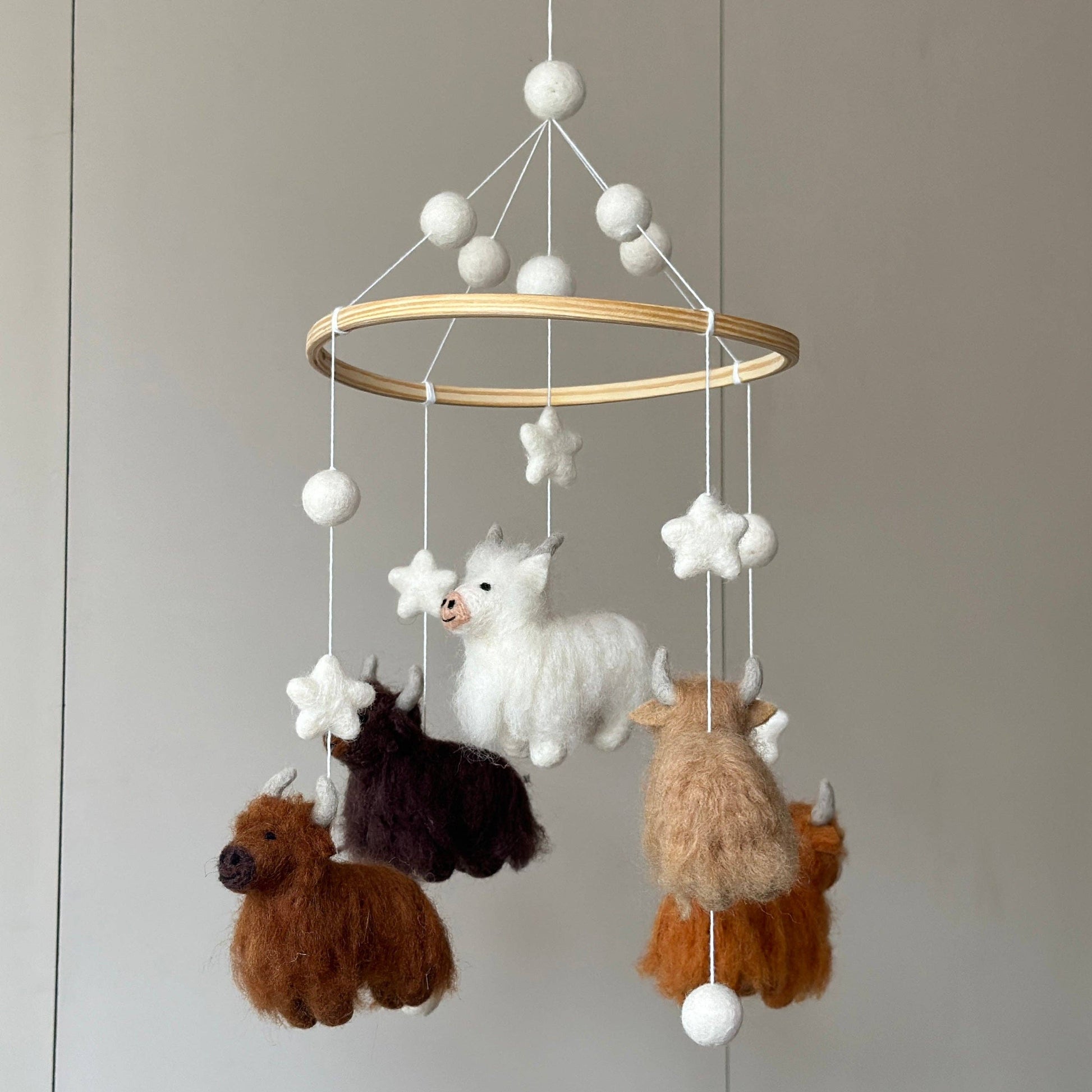 baby mobile with 5 needle felted wool highland cows in different colors