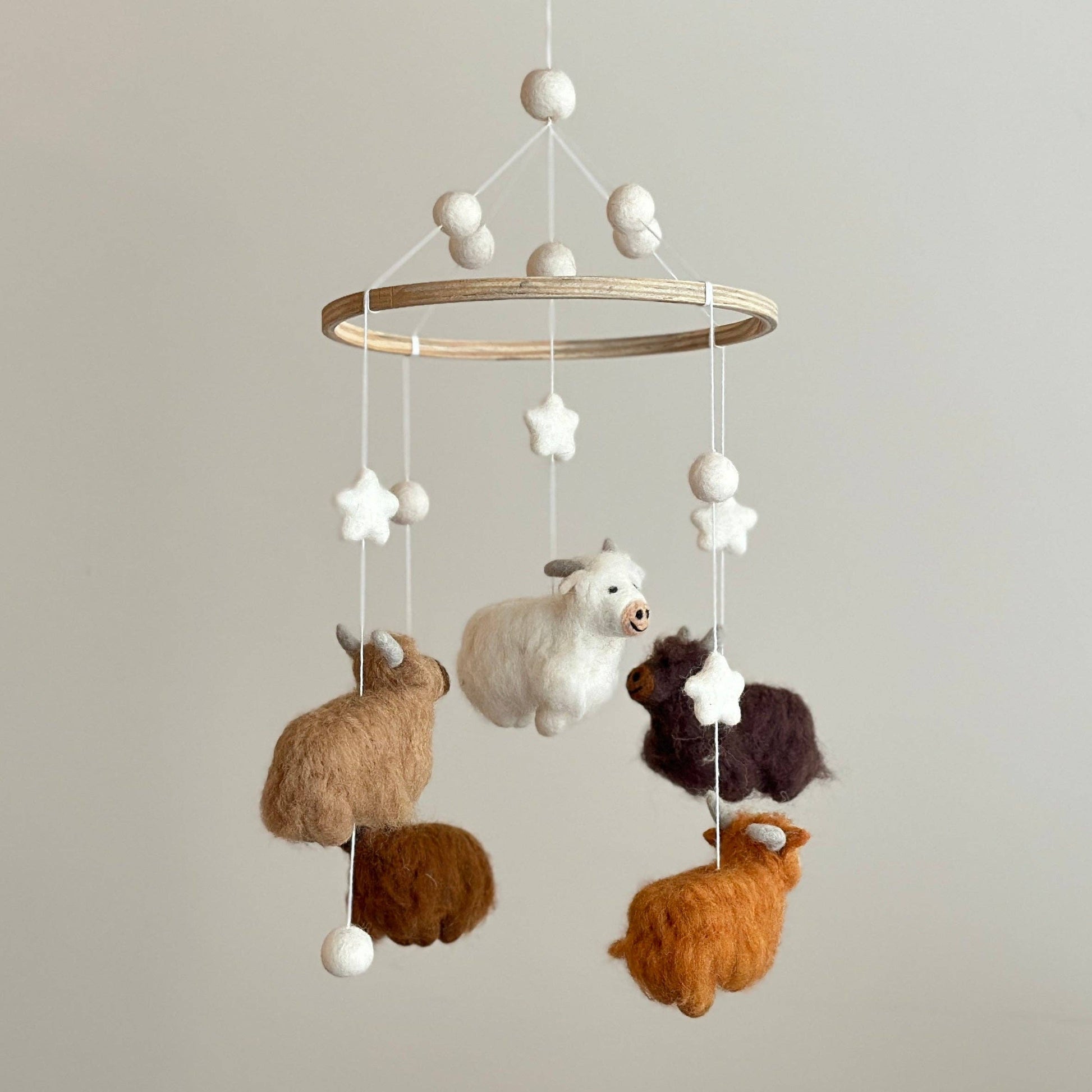 baby mobile with 5 needle felted wool highland cows in different colors