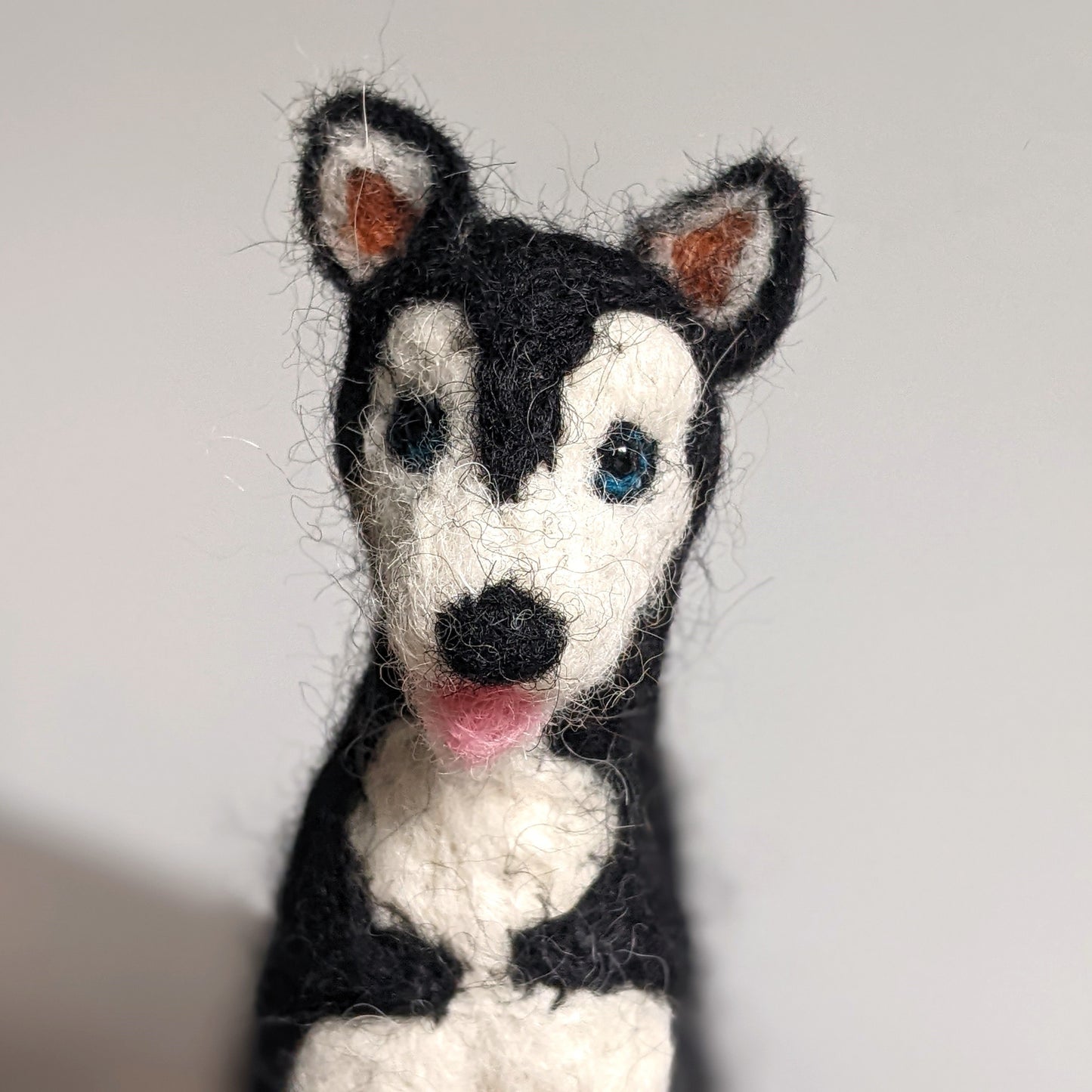 tiny needle felted wool husky dog close up