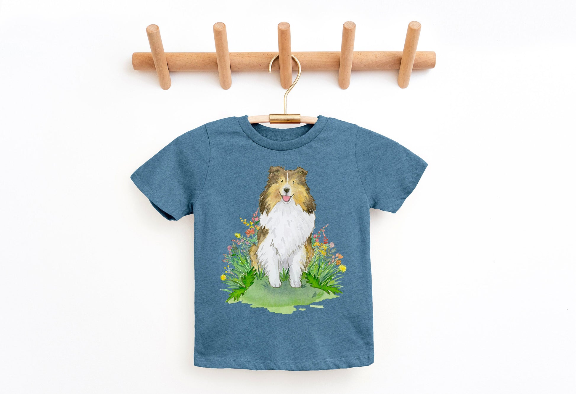 Kids tee shirt with sable sheltie dog and flowers on it.