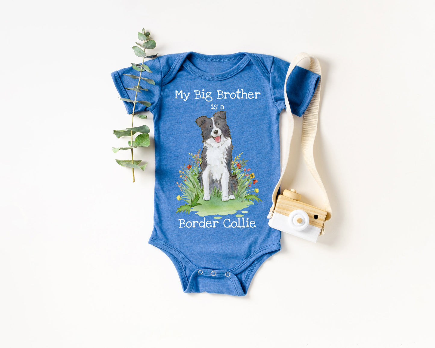 Baby bodysuit with a black and white border collie picture and "My big brother is a border collie" printed on it.