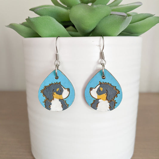 Hand-painted Bernese Mountain Dog Earrings made from laser engraved birch wood.