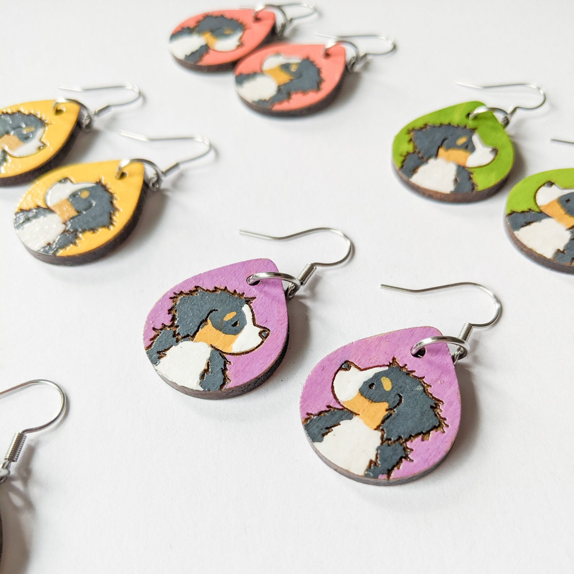 Hand-painted Bernese Mountain Dog Earrings made from laser engraved birch wood.