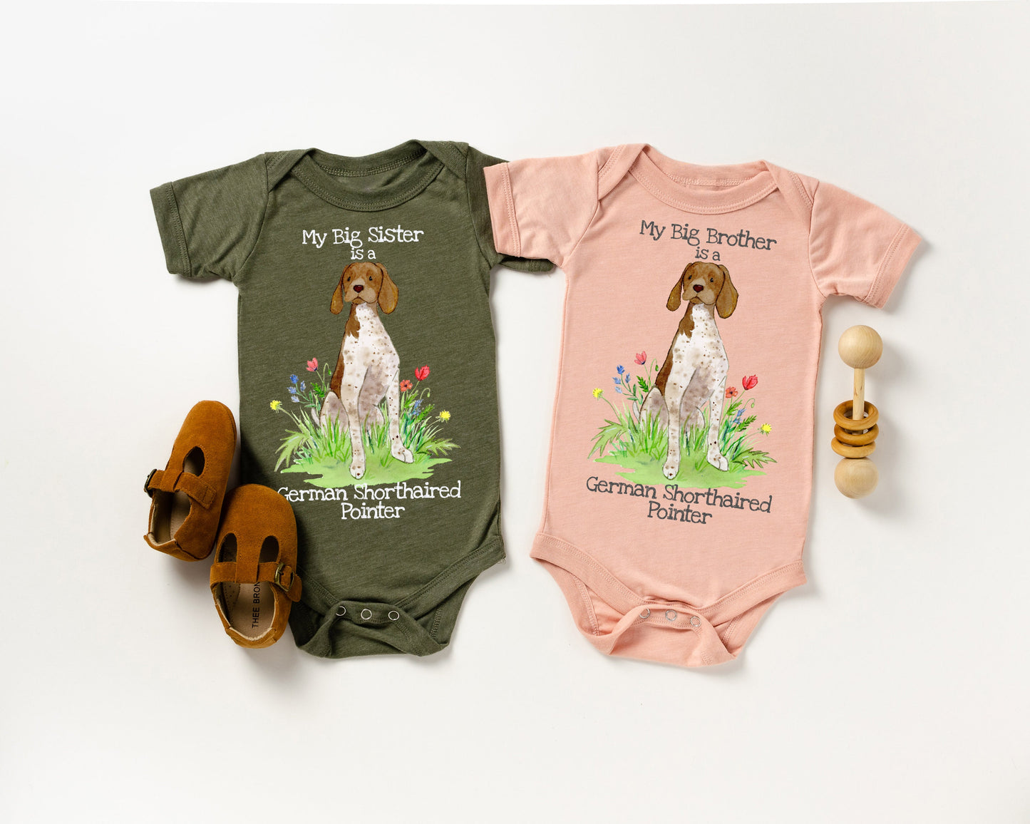Cute baby bodysuit with German shorthaired pointer artwork on it.