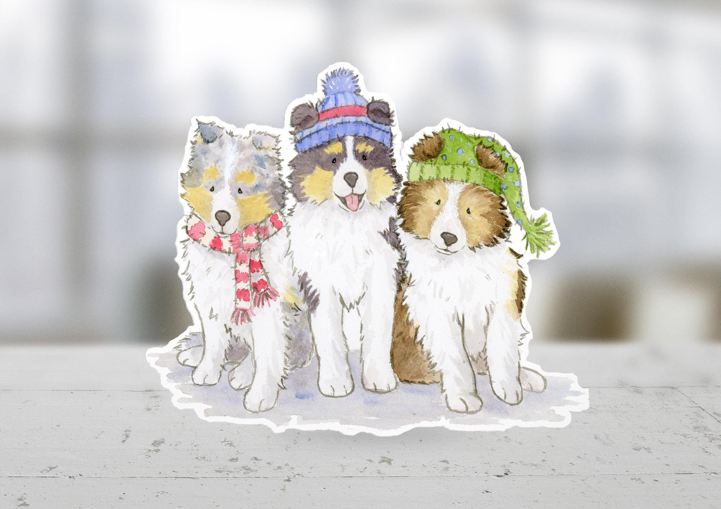 sheltie puppies wearing hats and scarves sticker