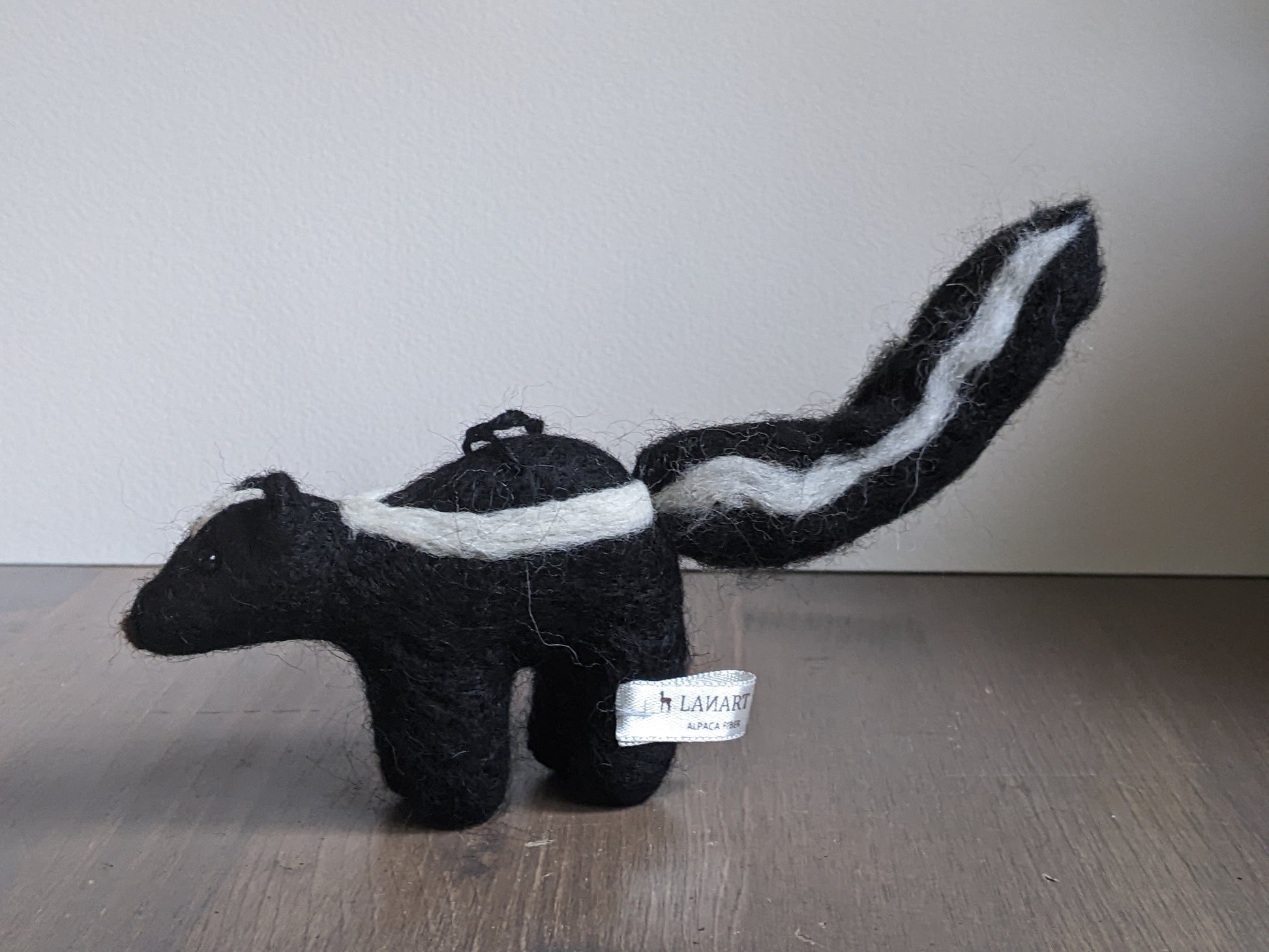 black and white needle felted wool skunk ornament