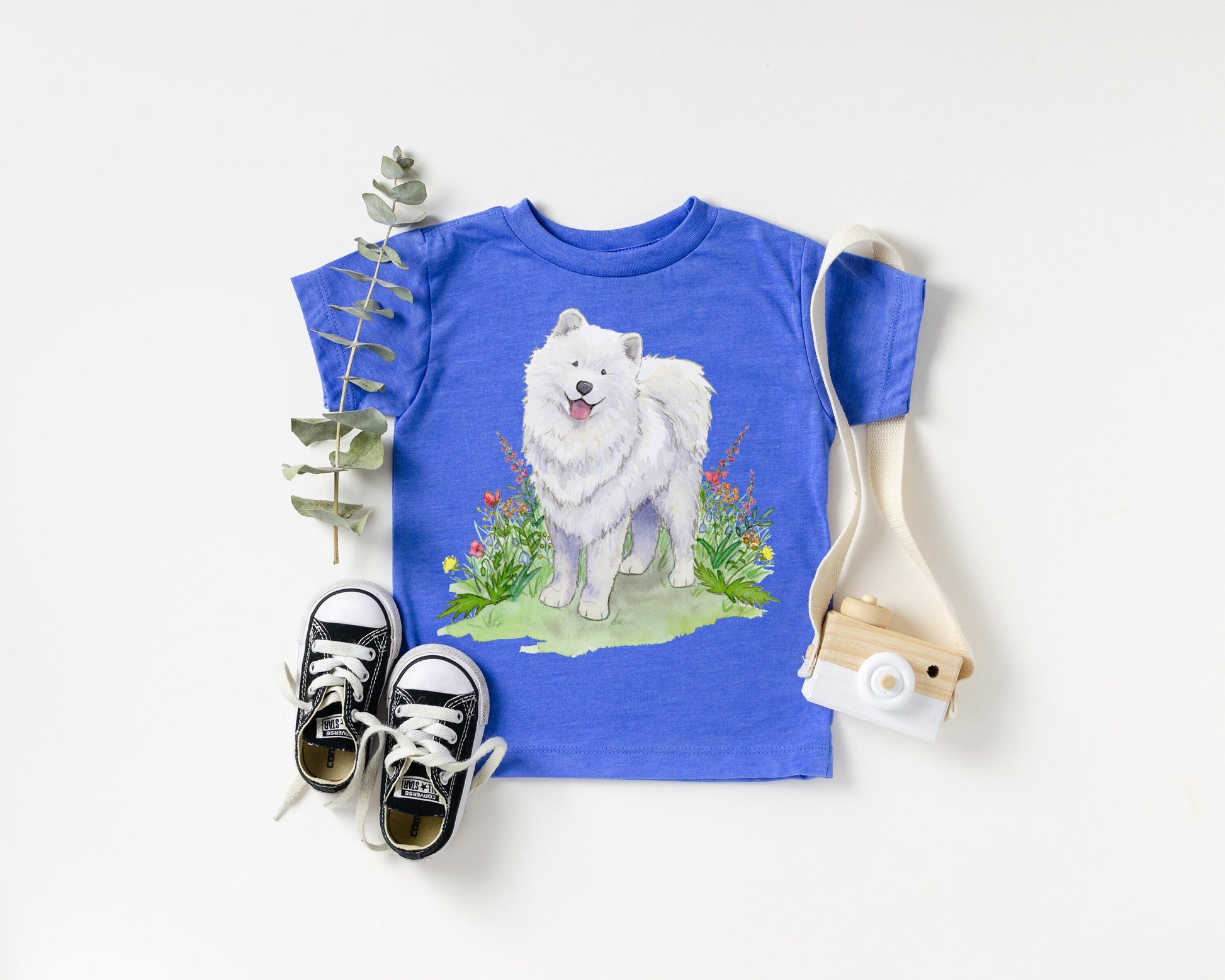 Blue toddler tee shirt with white samoyed dog and flowers on it.