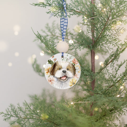 Ceramic circle ornament with watercolor artwork of a happy brown and white shih tzu dog and colorful flowers.
