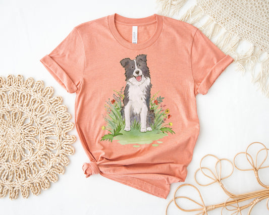 Orange tee with cute border collie and flowers on it.