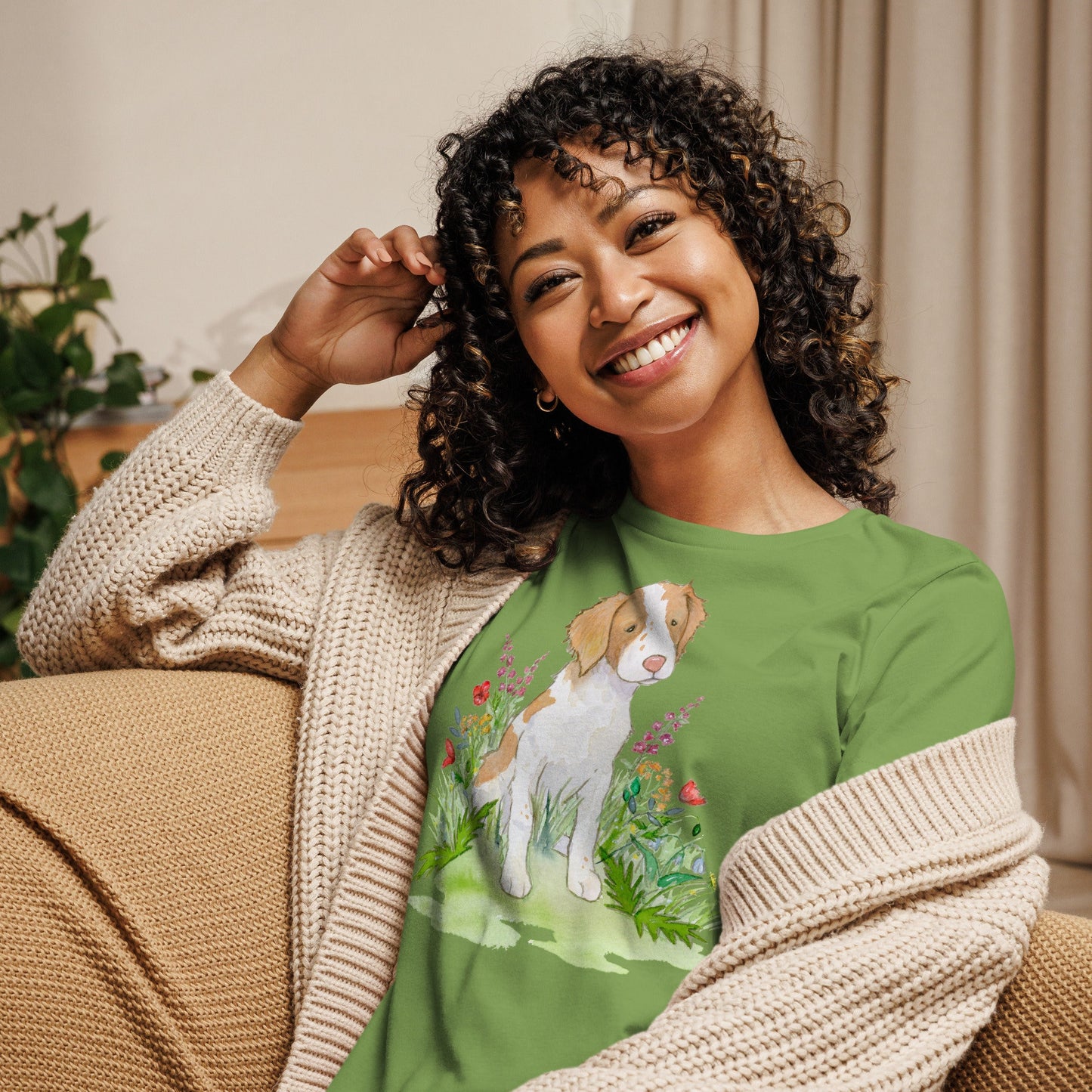 Green Brittany spaniel with flowers tee on model.