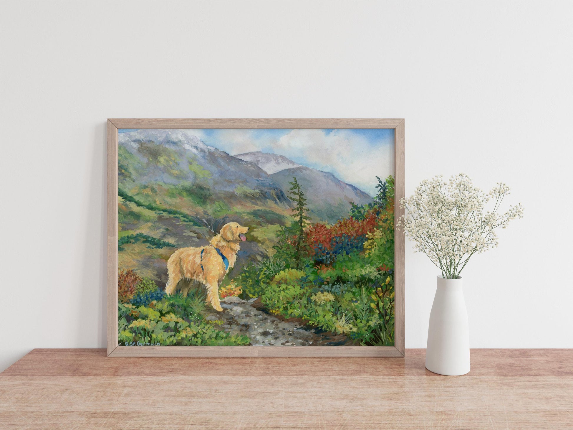 Framed gouache painting print of a golden retriever hiking in colorful tundra in the Alaskan mountains.