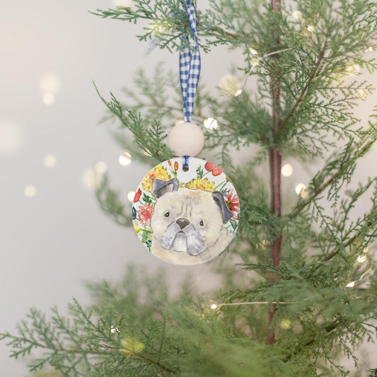 Ceramic Ornament with watercolor pug and colorful flowers on it.