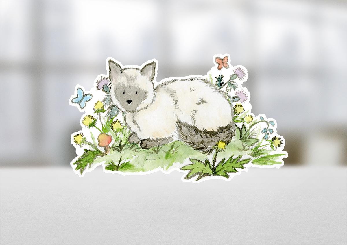 Sticker of a cat among flowers on a blurred background
