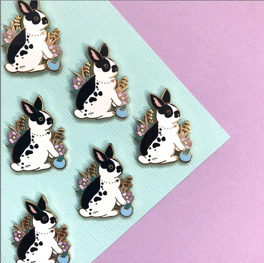 cute black and white bunny with flowers enamel pin