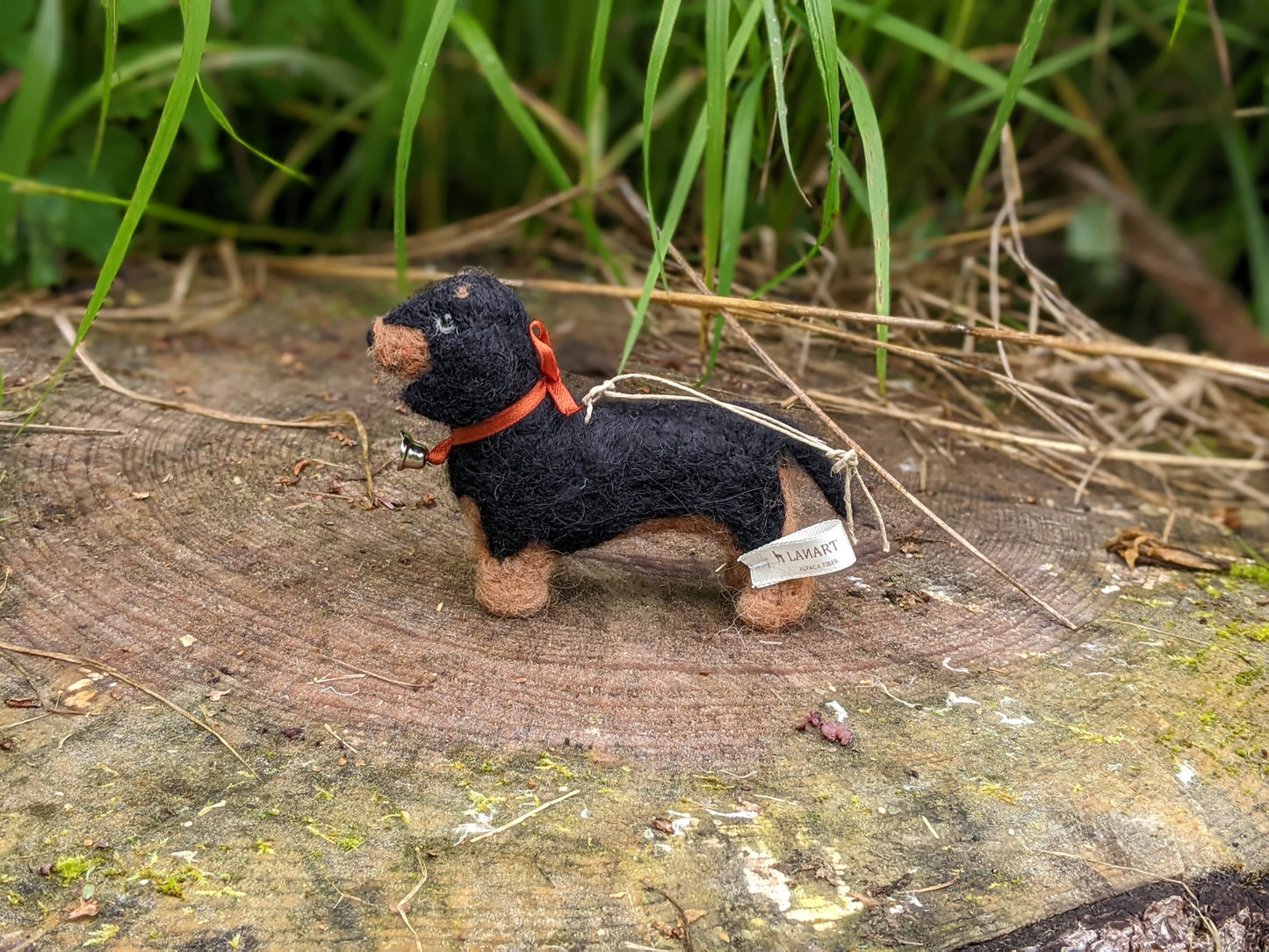 side view of black and tan needle felted dachshund dog