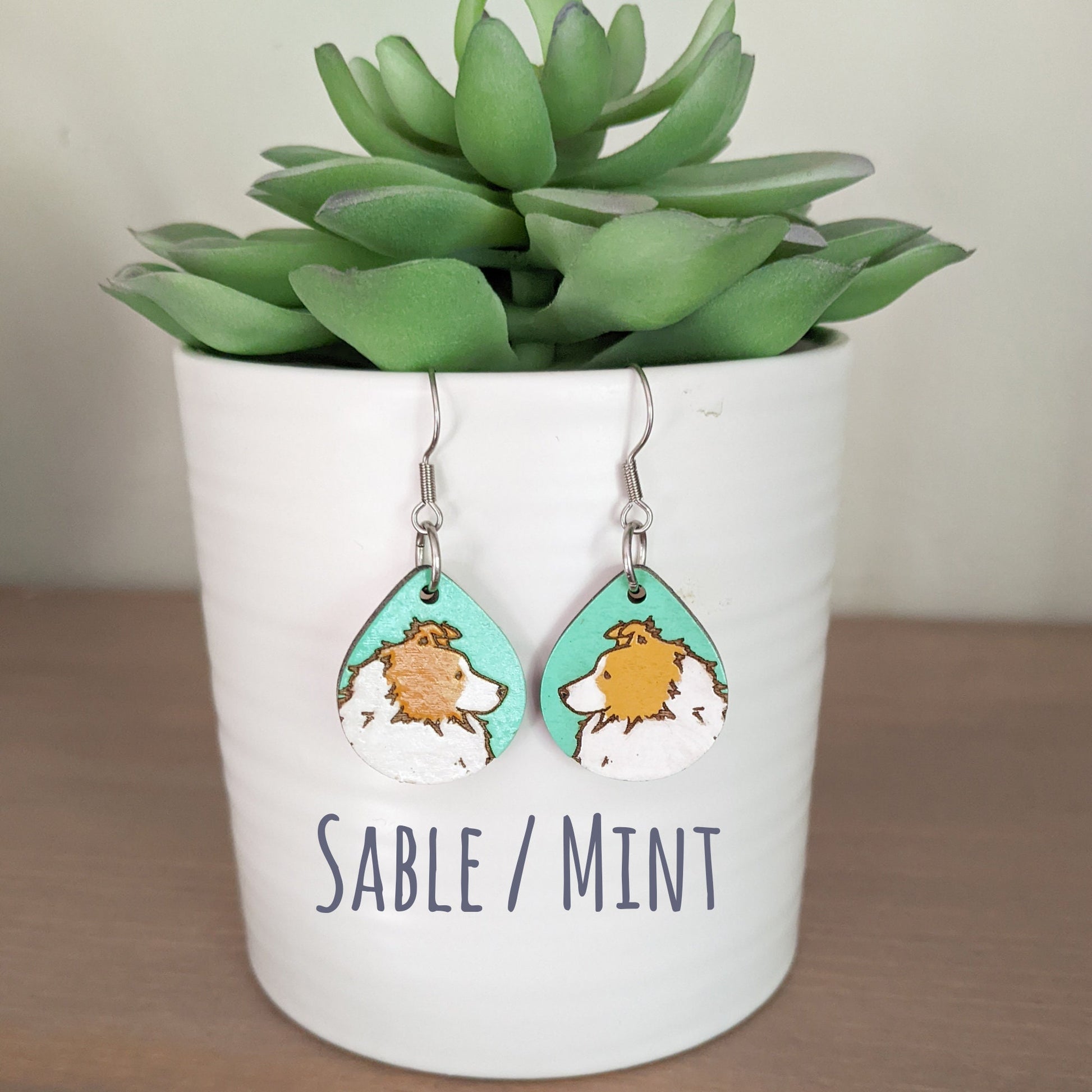 Sable hand painted, laser engraved sheltie earrings.