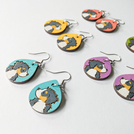 Hand-painted Bernese Mountain Dog Earrings made from laser engraved birch wood.