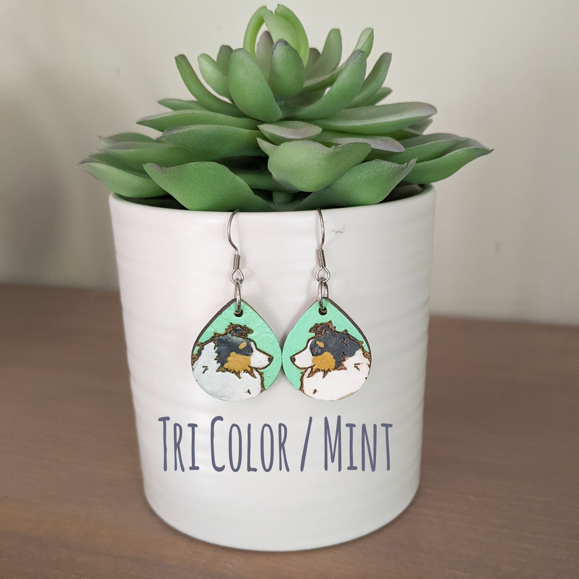 Tri Color hand painted, laser engraved sheltie earrings.