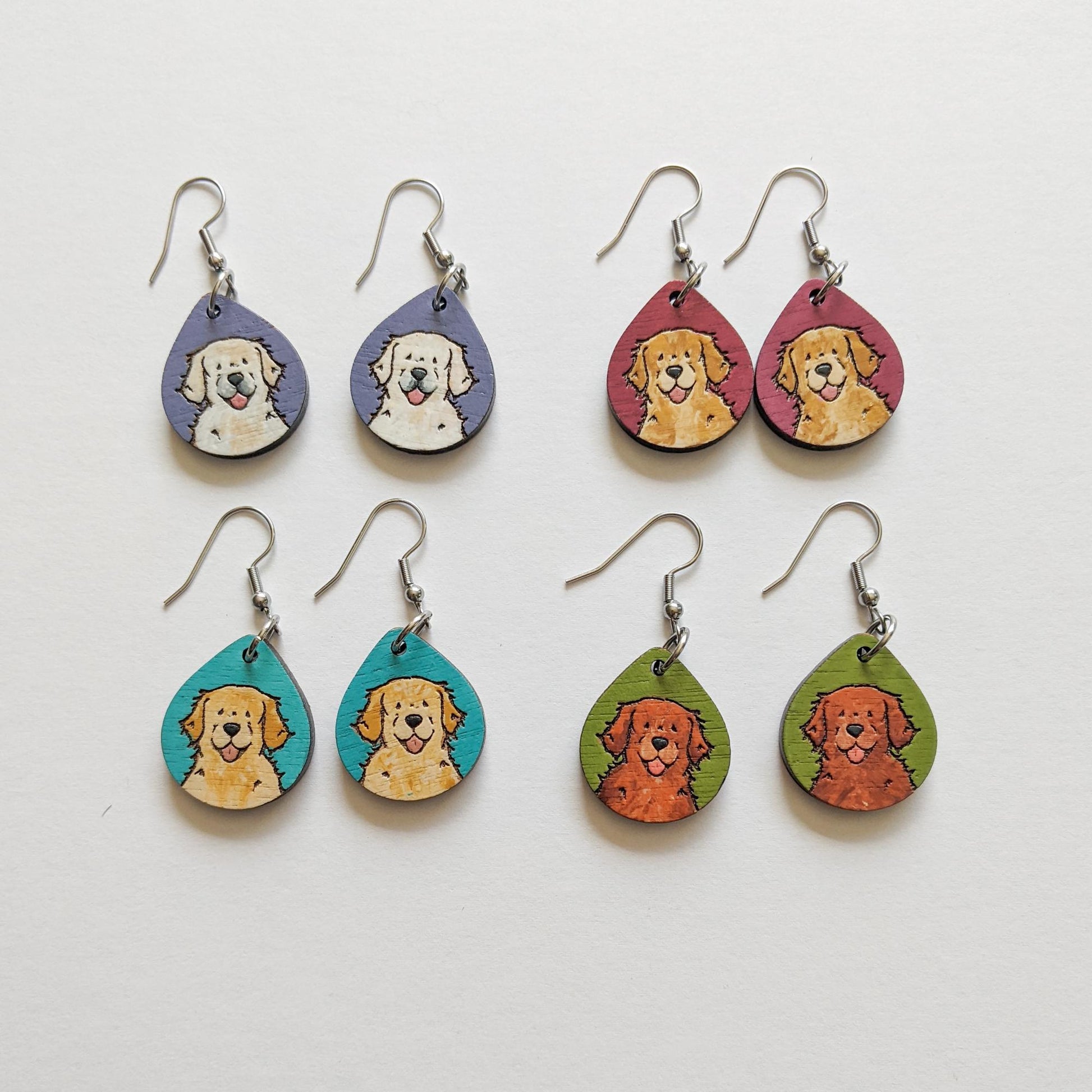 Laser cut golden retriever wood earrings in various colors