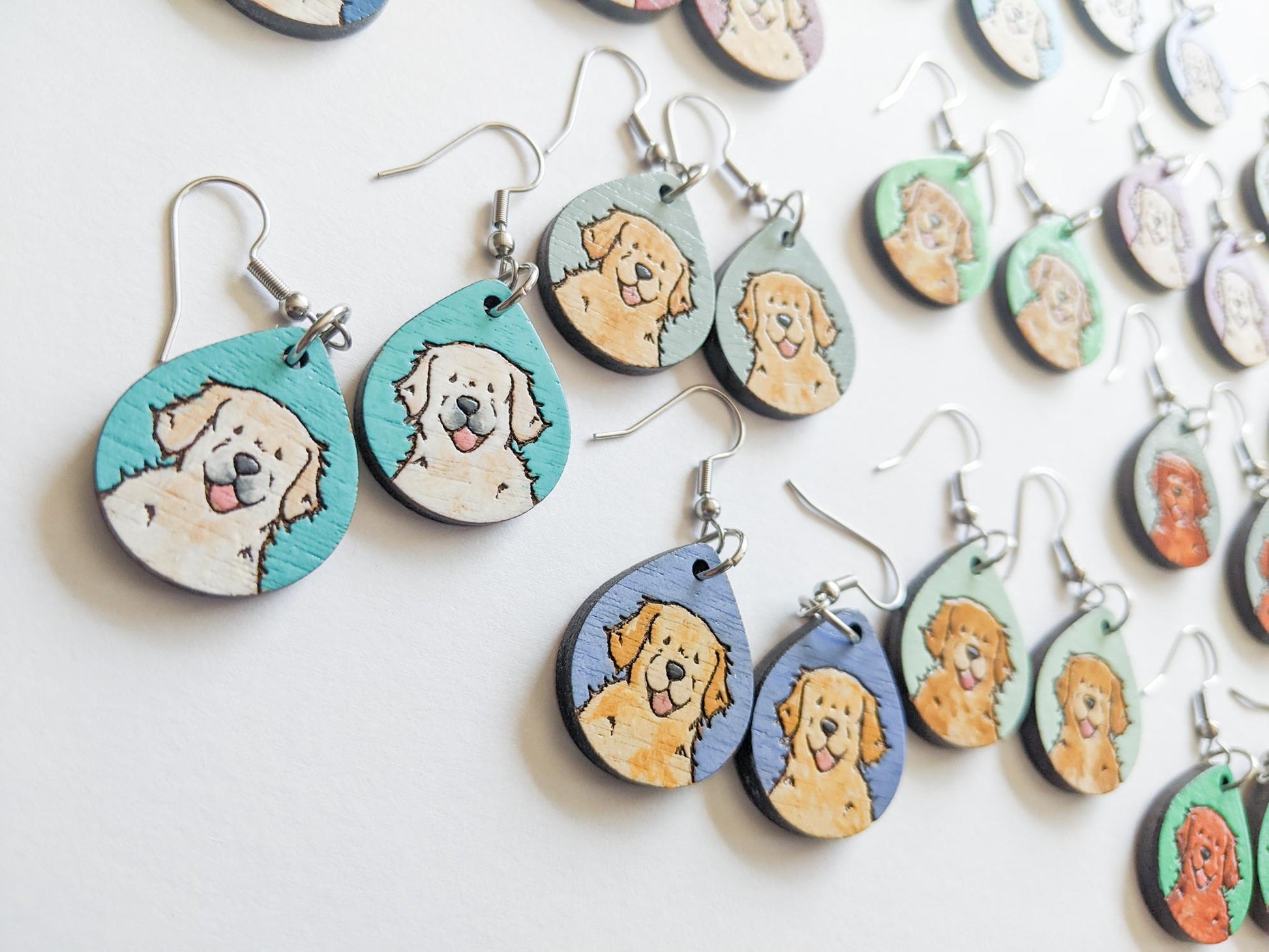 Laser cut golden retriever wood earrings in various colors