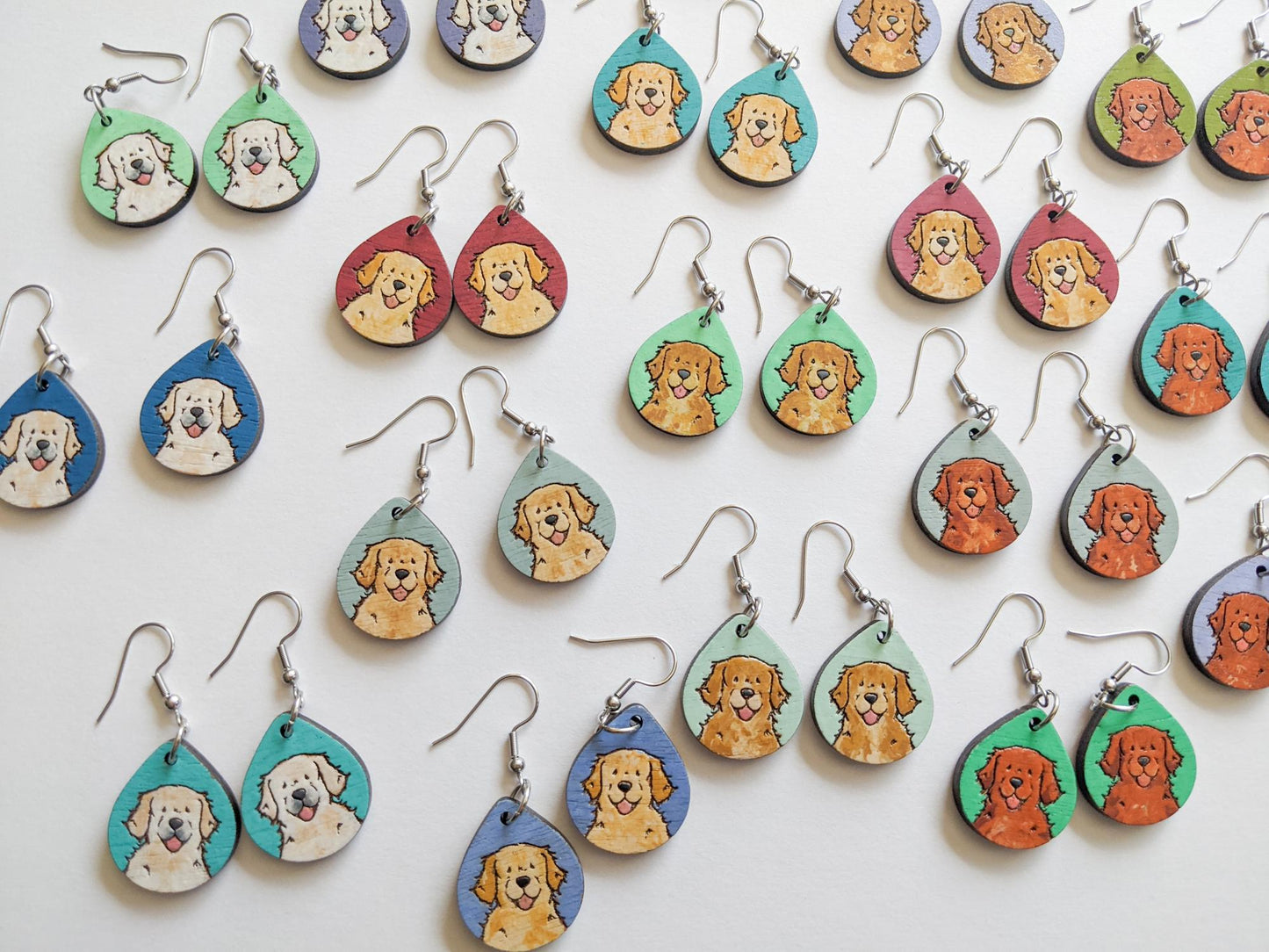 Laser cut golden retriever wood earrings in various colors