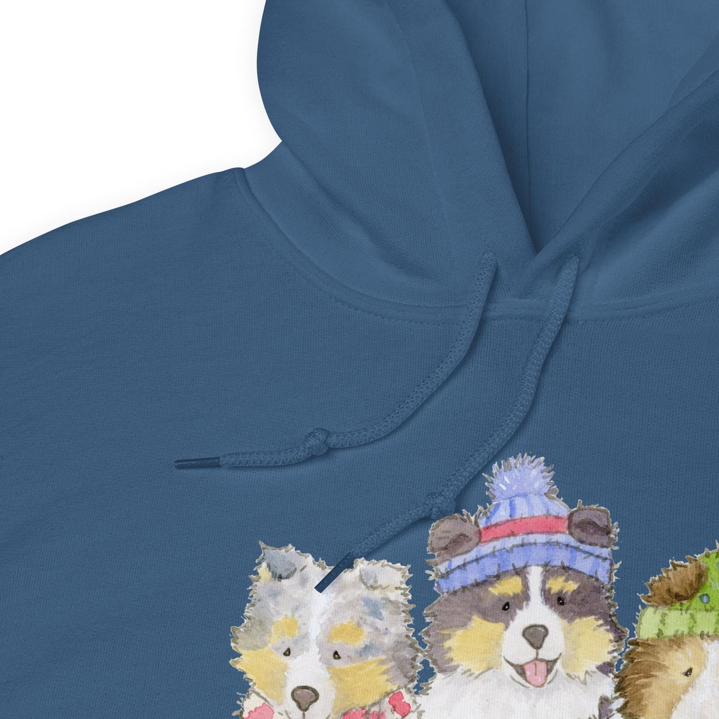 Hooded sweatshirt with three sheltie puppies wearing winter hats and scarves.