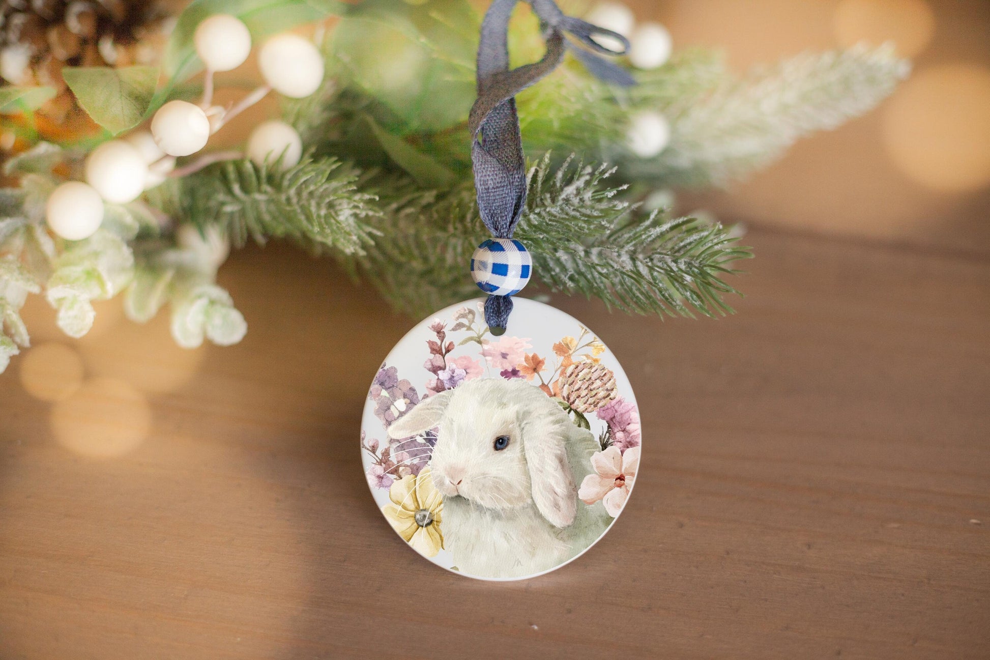 white holland lop bunny with flowers on a ceramic ornament