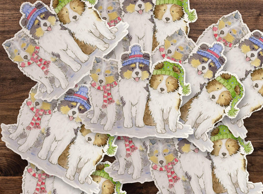 sheltie puppies wearing hats and scarves sticker