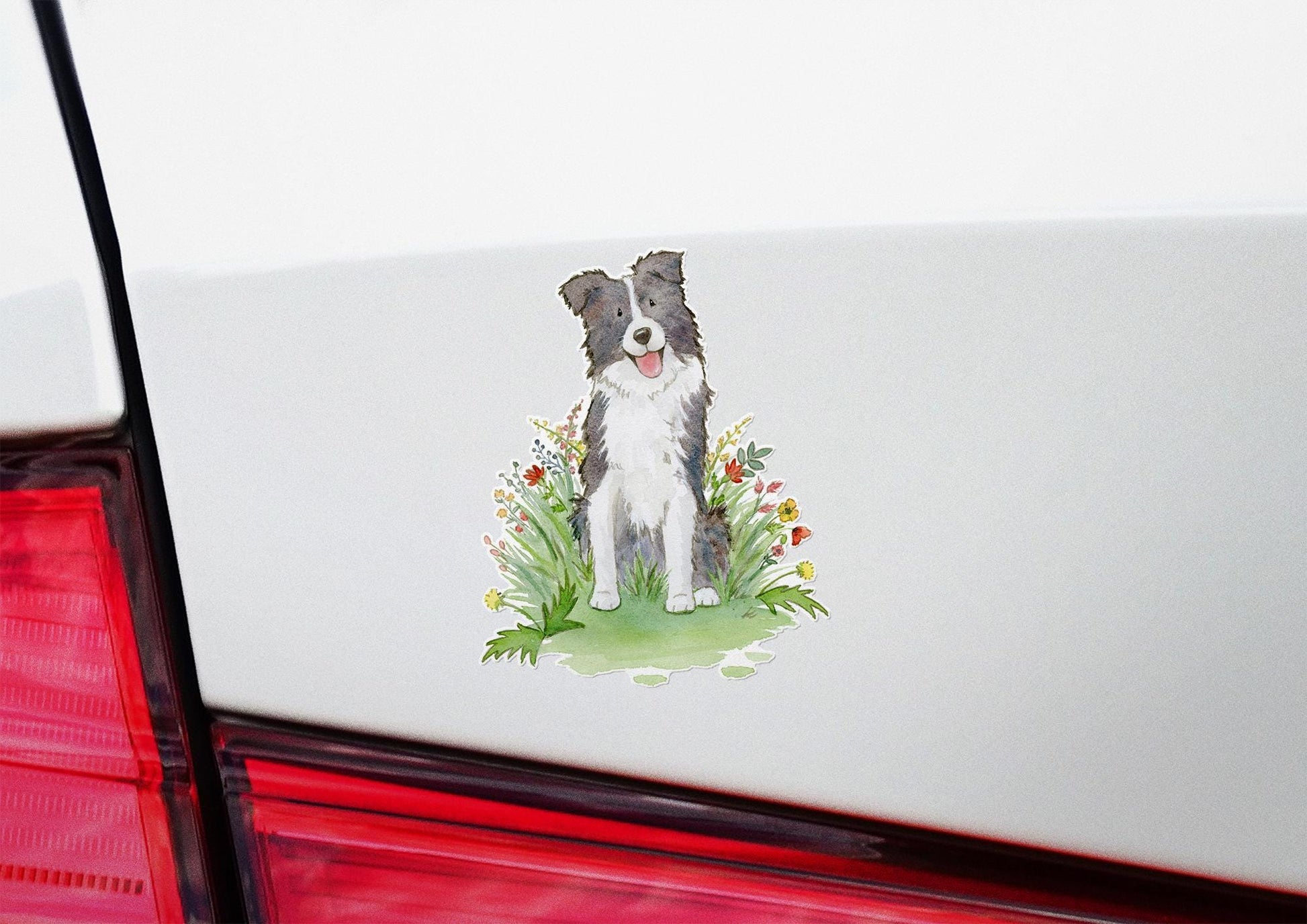 black and white border collie with flowers sticker