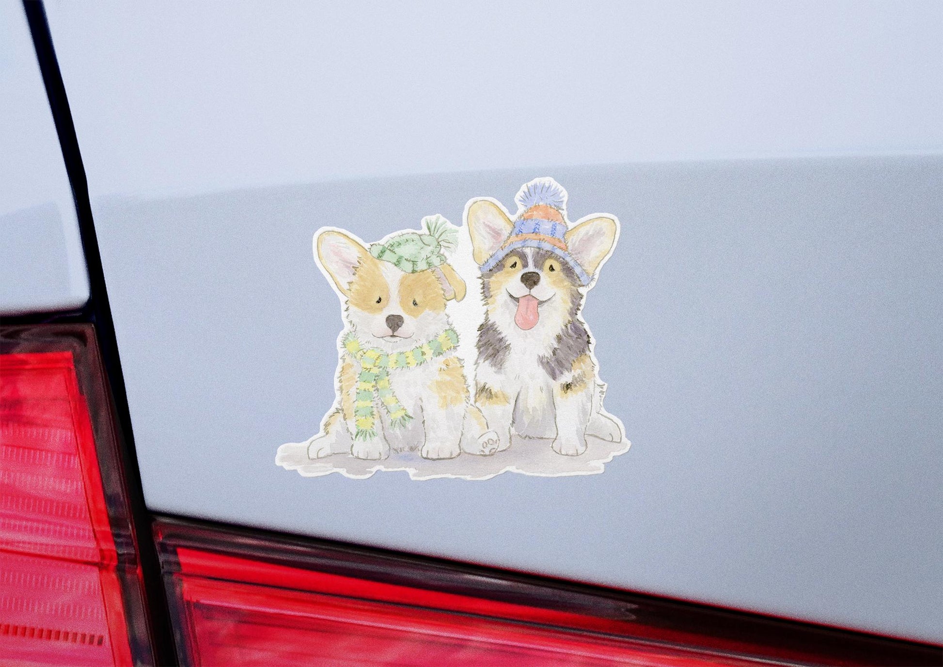 welsh corgi puppies wearing hats and scarves sticker