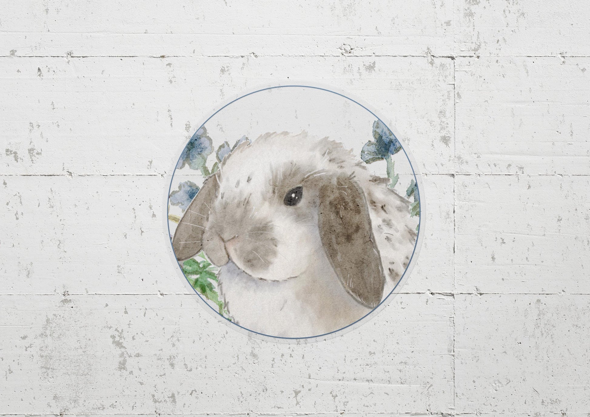 circle sticker of a gray and white holland lop bunny and flowers