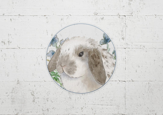 circle sticker of a gray and white holland lop bunny and flowers
