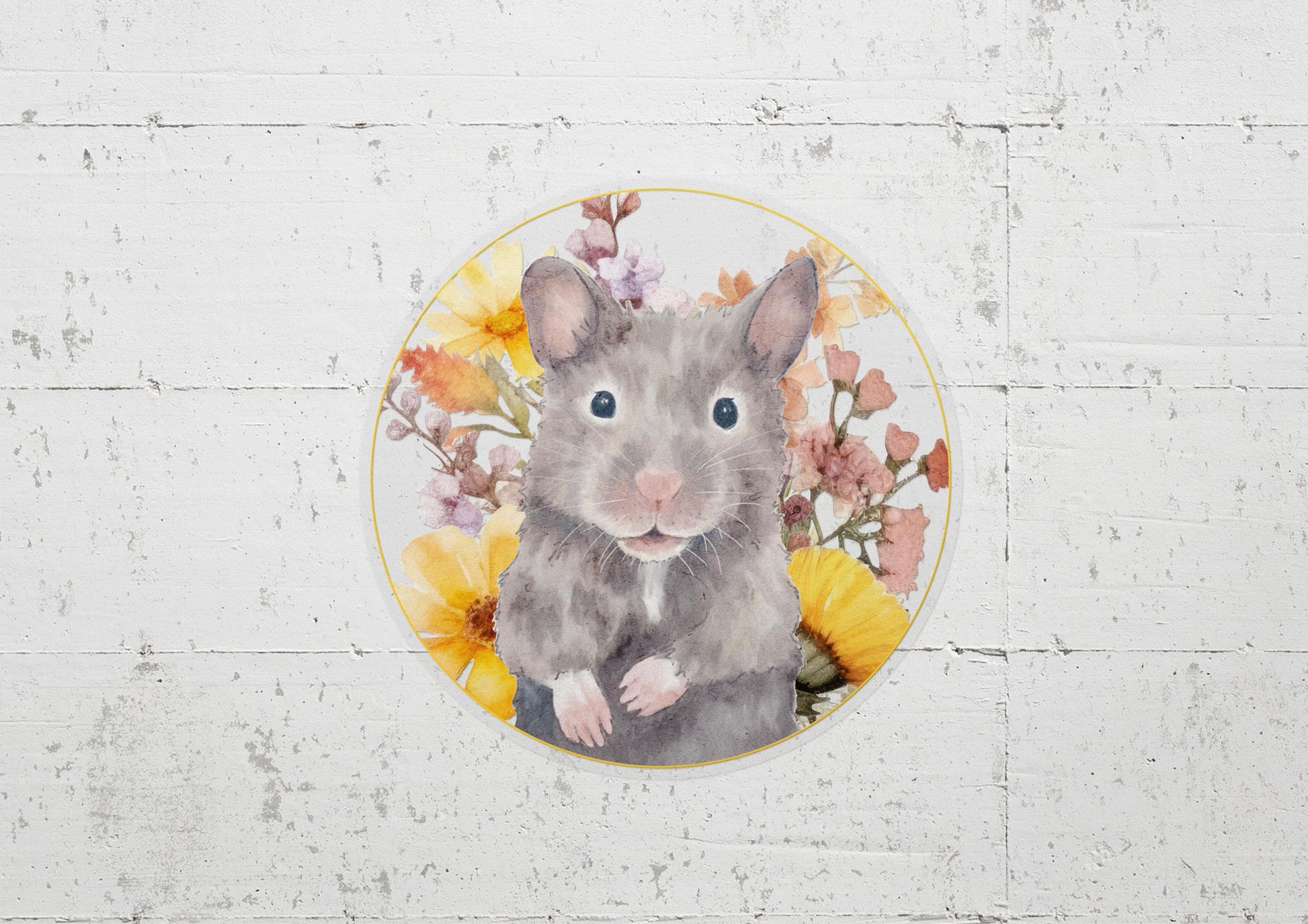 Round sticker with a cute, gray Syrian hamster and yellow and pink flowers on a transparent background