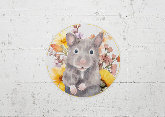 Round sticker with a cute, gray Syrian hamster and yellow and pink flowers on a transparent background
