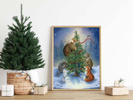 Framed art print with a cozy winter scene featuring Alaskan animals decorating a Christmas tree.  The painting is surrounded by gifts and a small Christmas tree.