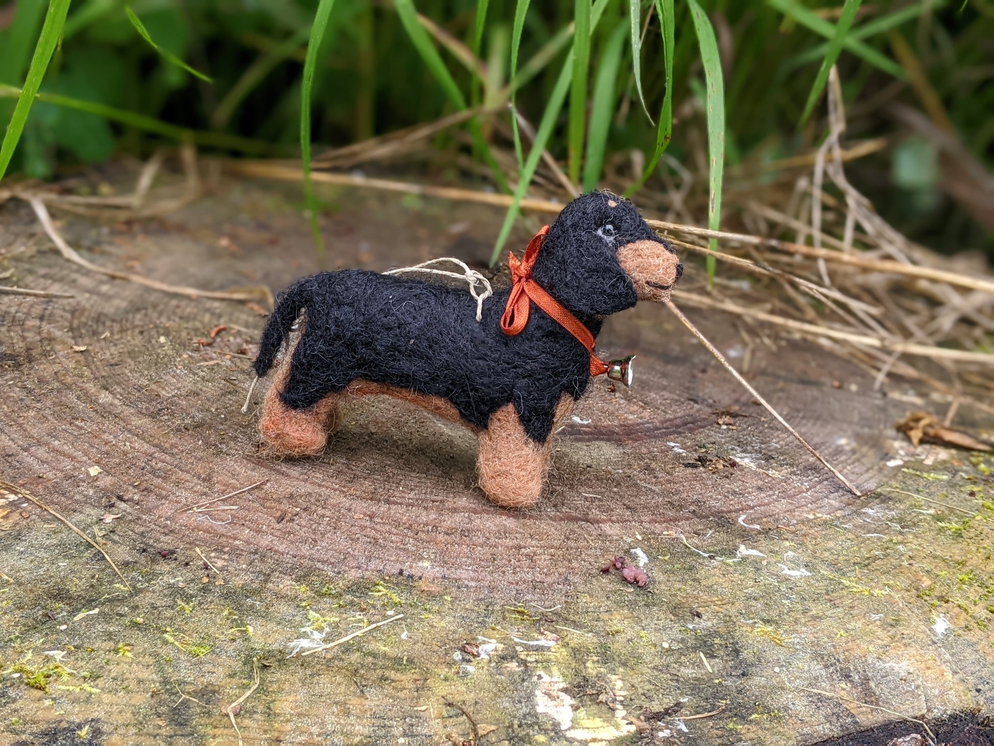 side view of black and tan needle felted dachshund toy