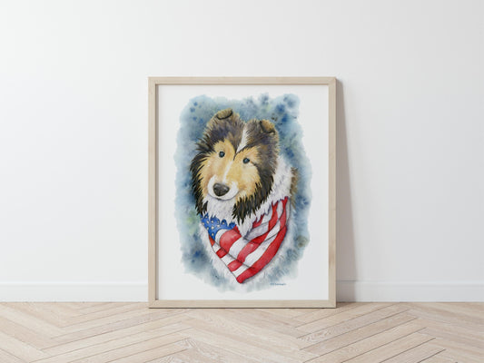 Framed artwork of a sheltie wearing an American flag bandana on a white wall.