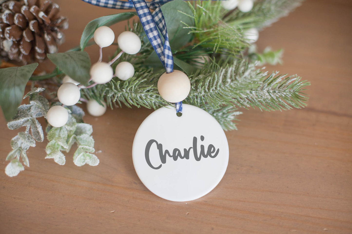 Back of white ceramic ornament with personalized name &quot;Charlie&quot;.