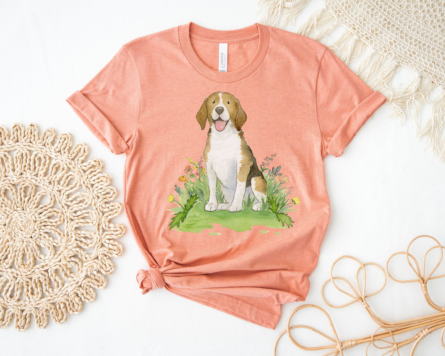 Orange pink colored t-shirt with cute beagle artwork on it.