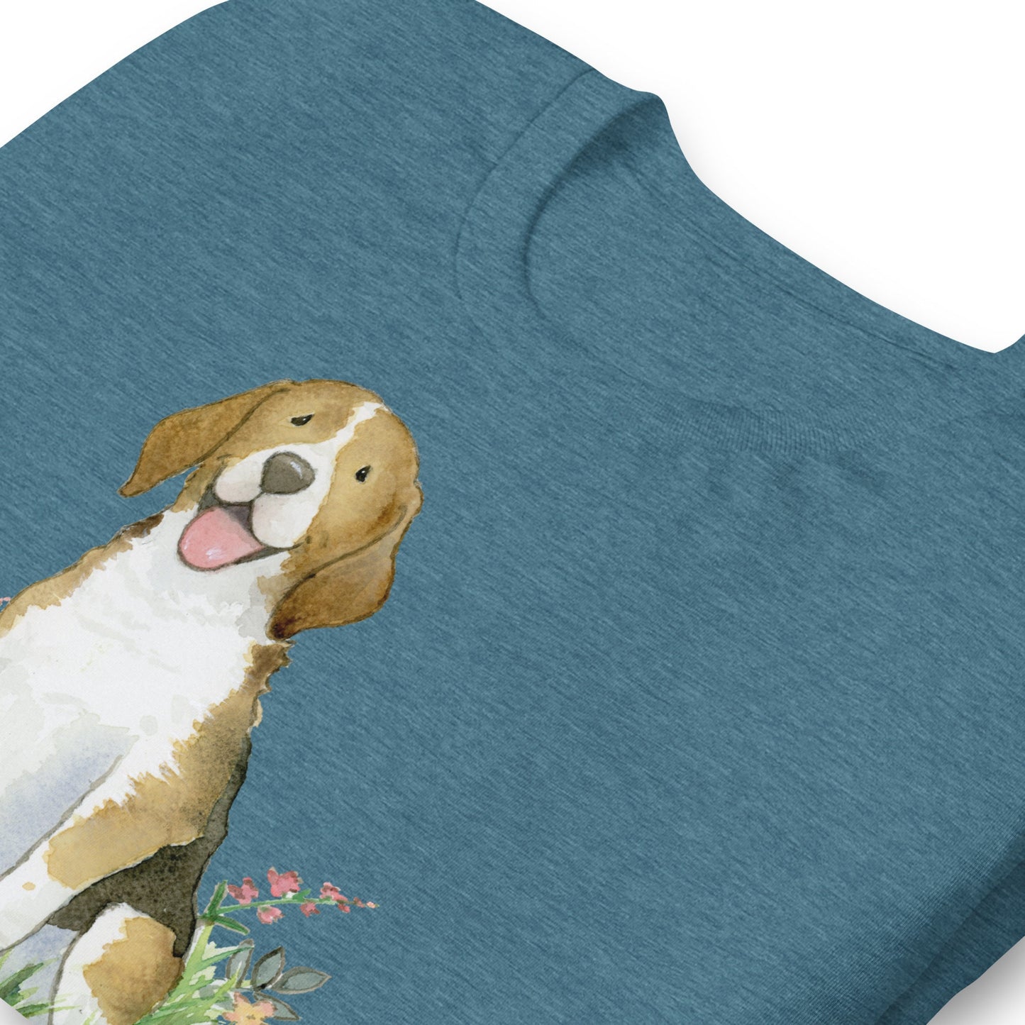 Folded deep teal colored t-shirt with cute beagle artwork on it.