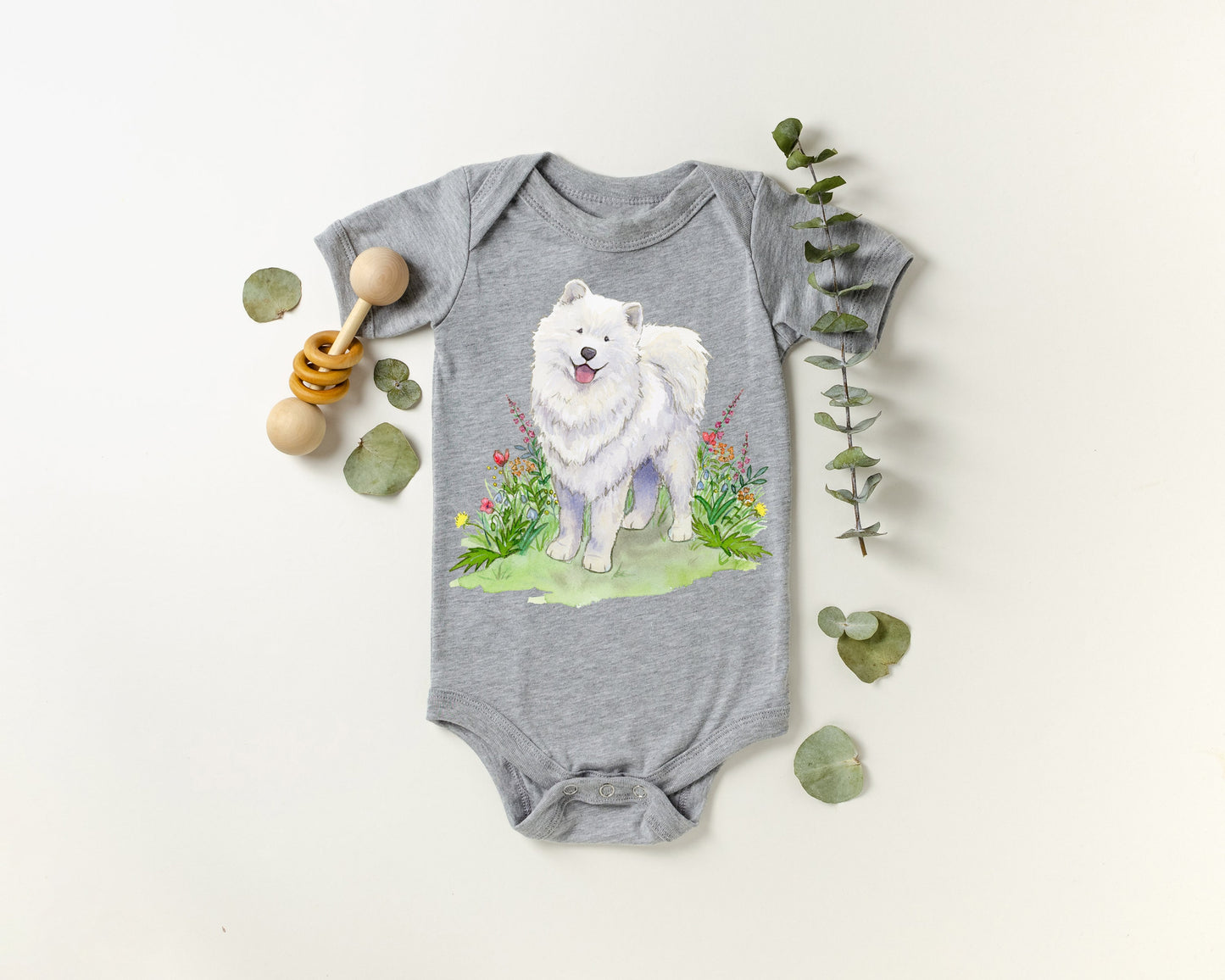 One-piece infant bodysuit with cute samoyed dog and flowers artwork.