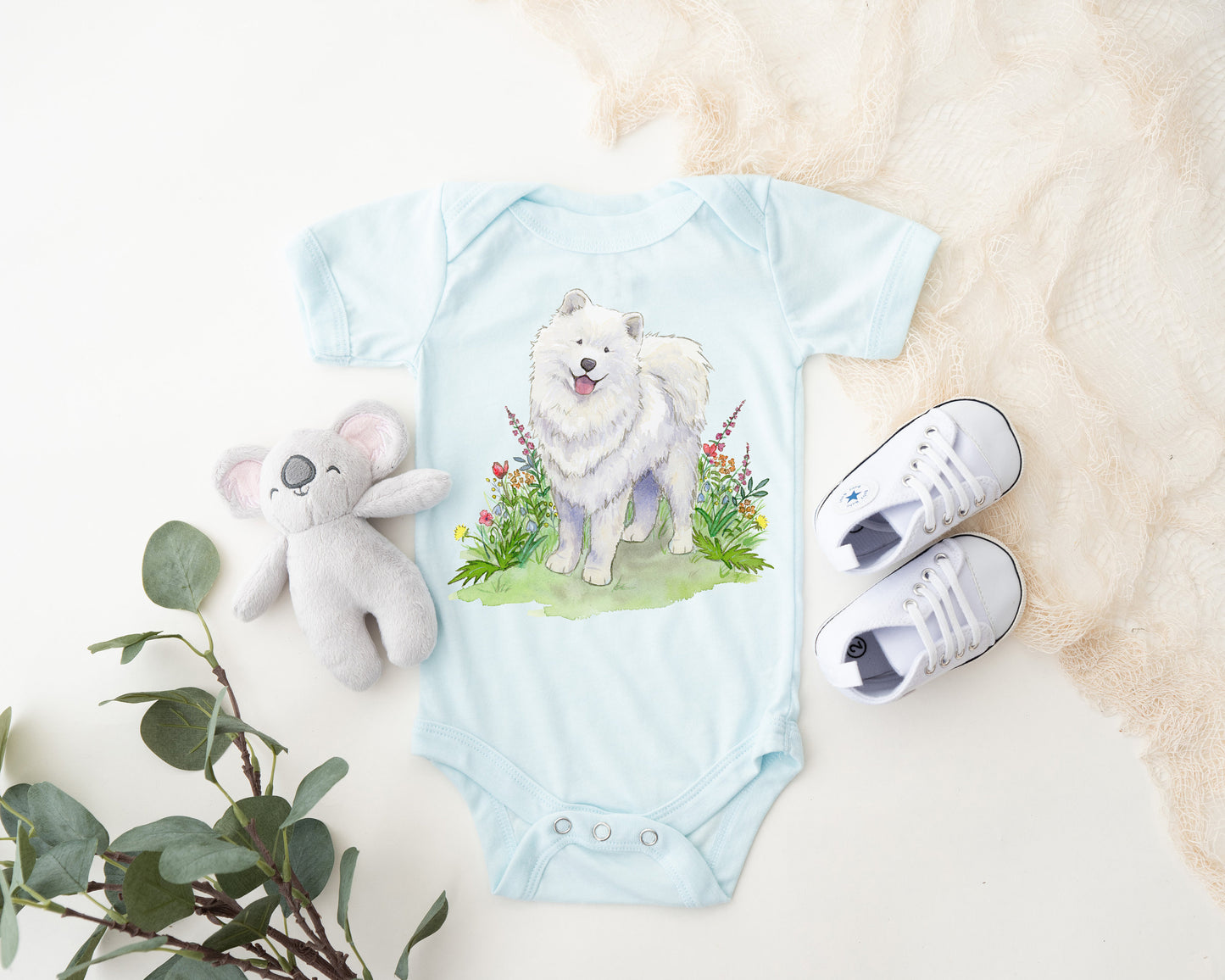 One-piece infant bodysuit with cute samoyed dog and flowers artwork.