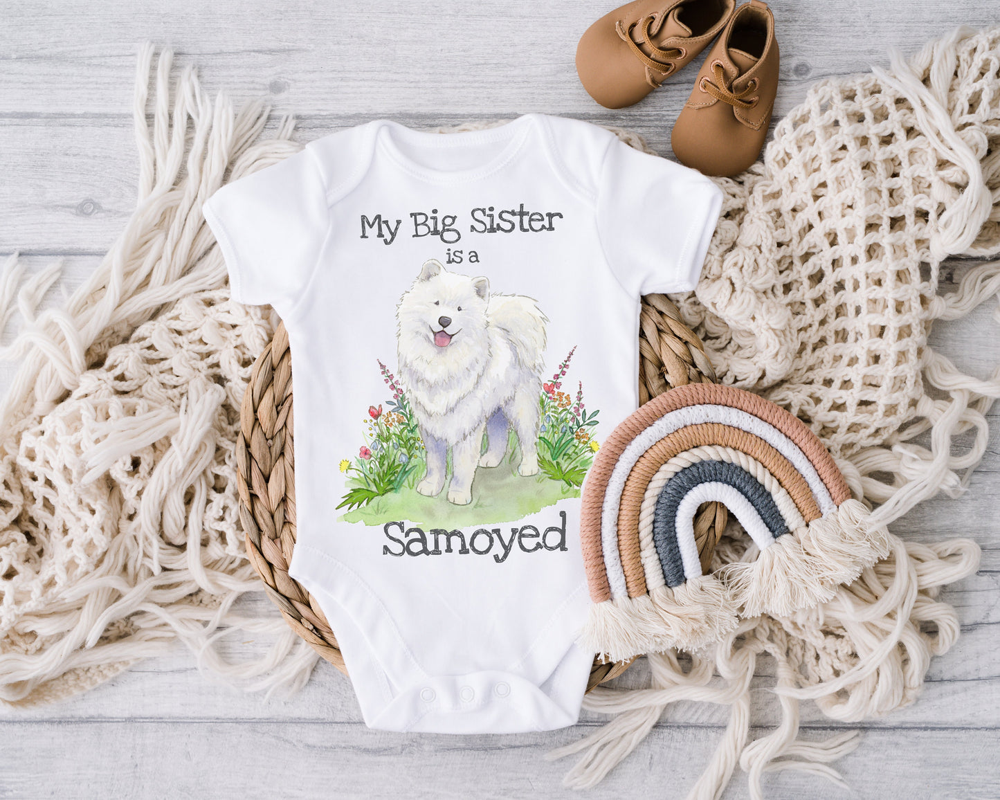 One-piece infant bodysuit with cute samoyed dog and flowers artwork.